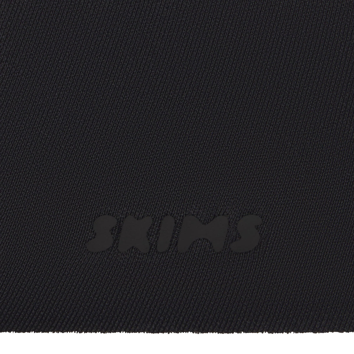 SKIMS ULTIMATE BODY PUSH-UP THONG BODYSUIT | ONYX