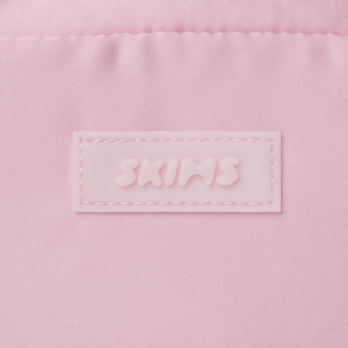 SKIMS ACCESSORIES SATIN MINI DUFFLE BAG | PEONY