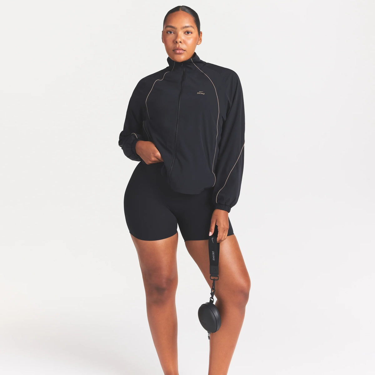 NikeSKIMS STRETCH NYLON OVERSIZED TRACK JACKET | OBSIDIAN OLIVE GREY