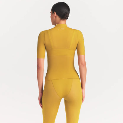 NikeSKIMS WEIGHTLESS LAYERS MOCK NECK SHORT SLEEVE T-SHIRT | CITRINE