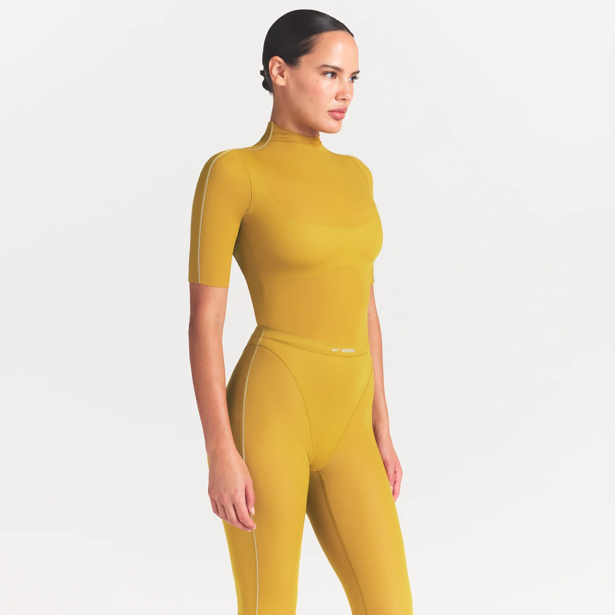 NikeSKIMS WEIGHTLESS LAYERS MOCK NECK SHORT SLEEVE T-SHIRT | CITRINE