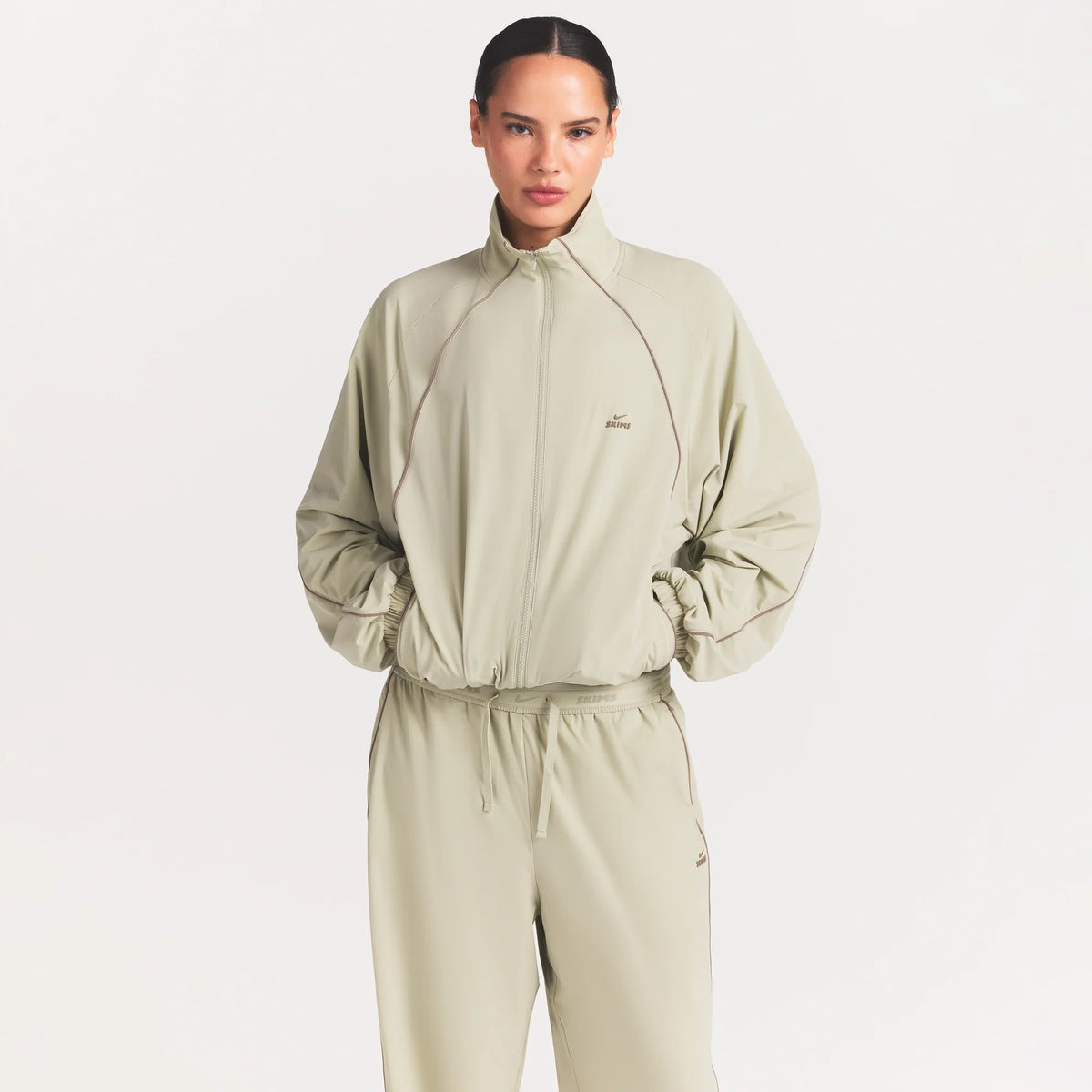 NikeSKIMS STRETCH NYLON OVERSIZED TRACK JACKET | TALC