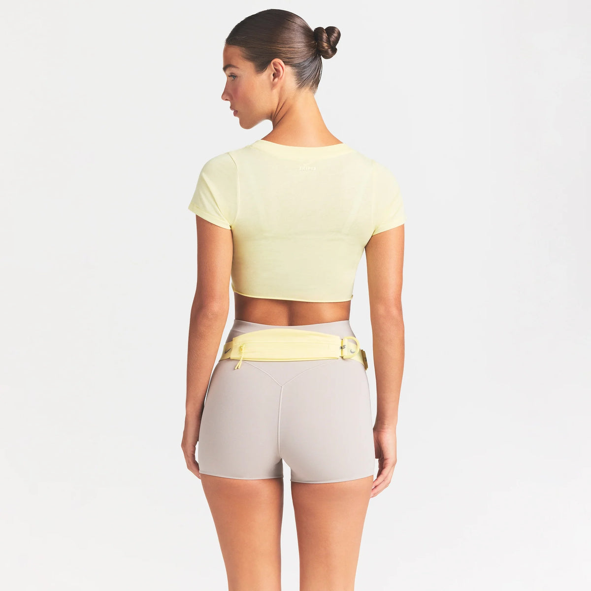NikeSKIMS PERFORMANCE COTTON BLEND SHORT SLEEVE V-NECK CROP TOP | BICYCLE YELLOW